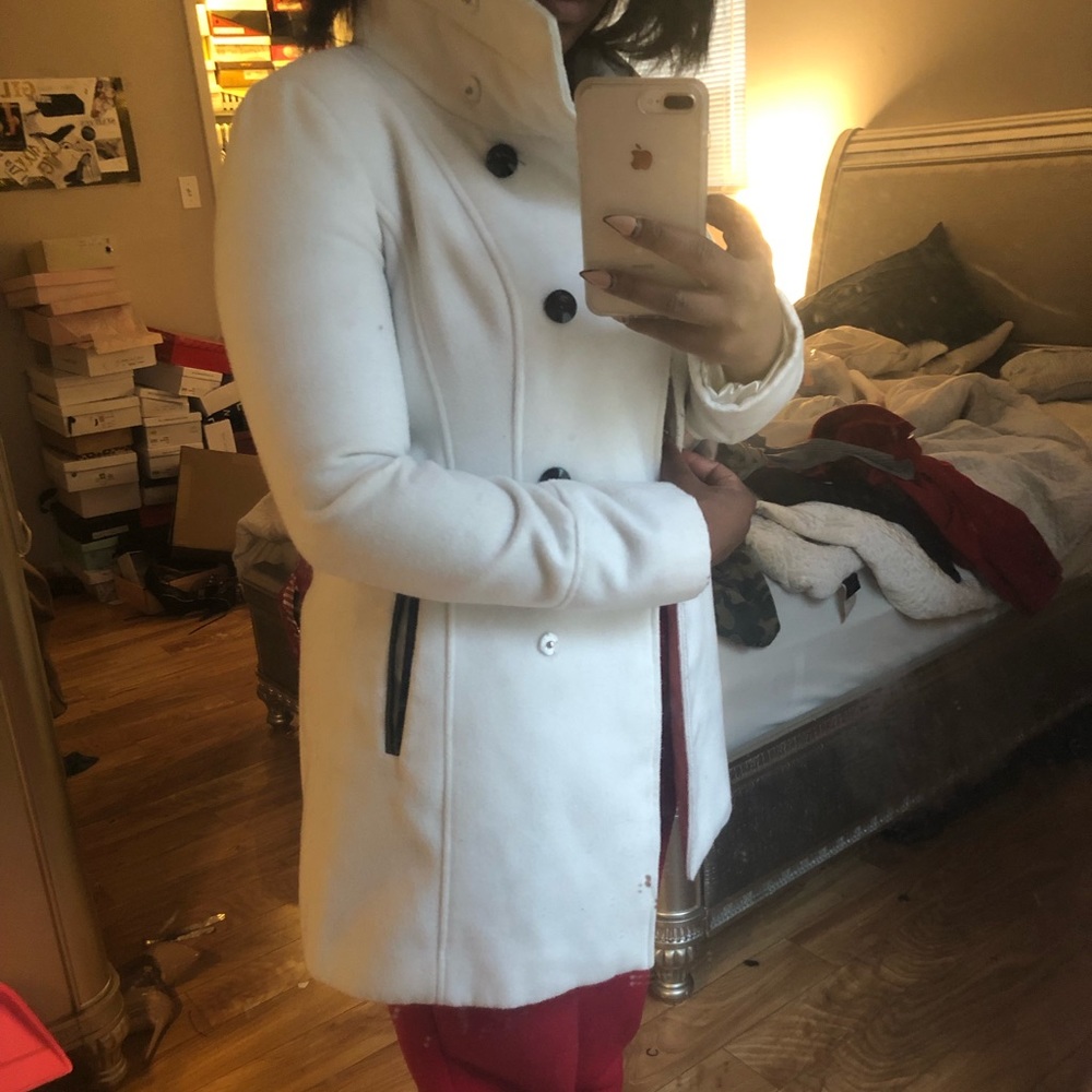 White peacoat with black buttons